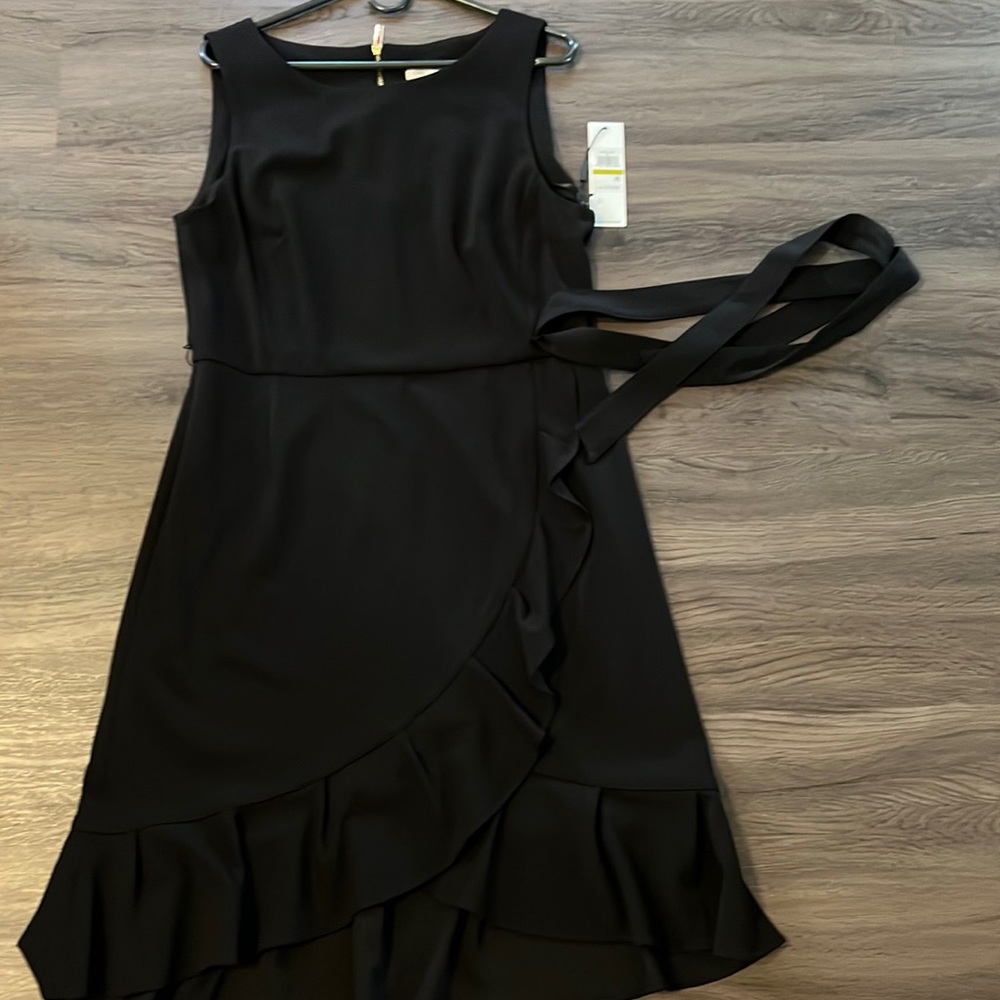 Elegant black Calvin Klein sleeveless with gold zipper in the back dress. NWT